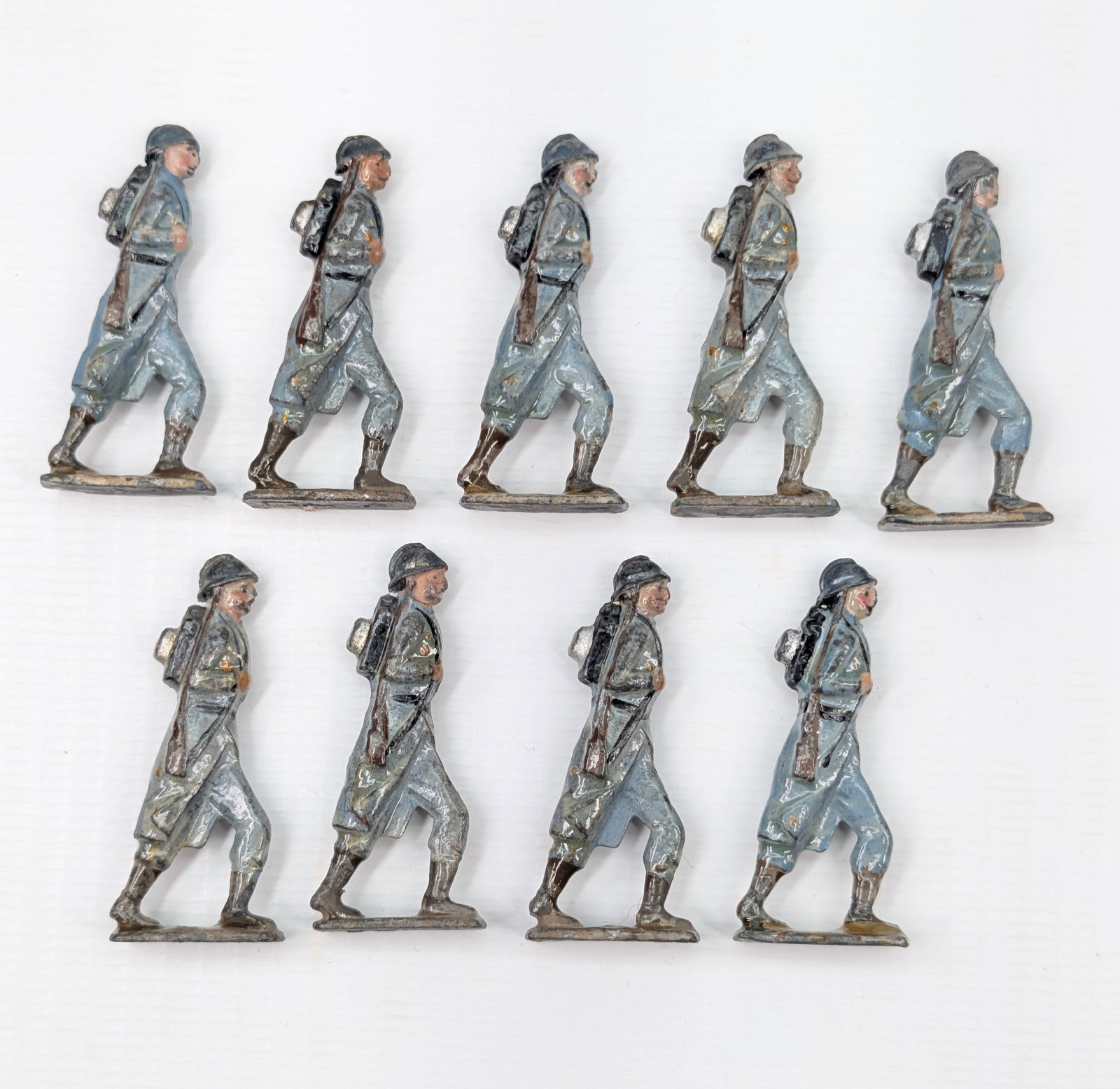 SET OF 9 HAND PAINTED FLAT LEAD SOLDIERS: ALL REMAIN IN FAIR TO GOOD CONDITION, SHOWING SOME TYPICAL WEAR.