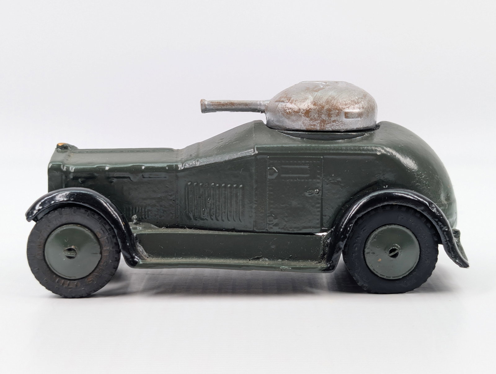 VINTAGE BRITAINS LTD ARMOURED CAR: REMAINS IN FAIR CONDITION, SHOWING SOME TYPICAL WEAR.