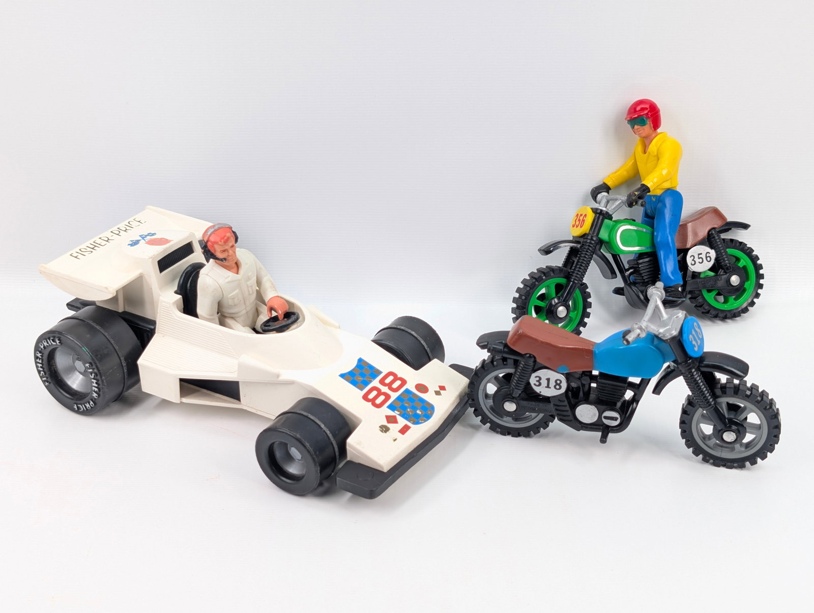 FISHER PRICE INDY CAR & 2 MOTORCYCLES: ALL REMAIN IN GOOD CONDITION, SHOWING SOME TYPICAL WEAR.