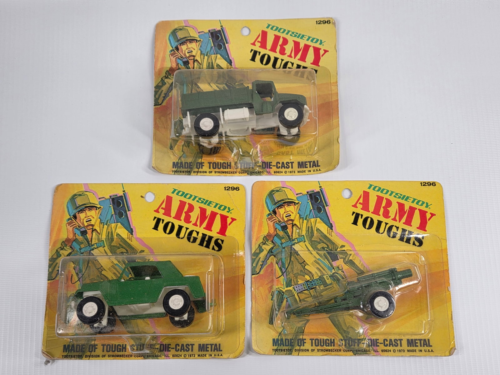 3) VINTAGE TOOTSIETOY ARMY TOUGHS DIECAST NIP: ALL REMAIN NEW IN PACKAGE, PACKAGING SHOWING SOME WEAR.