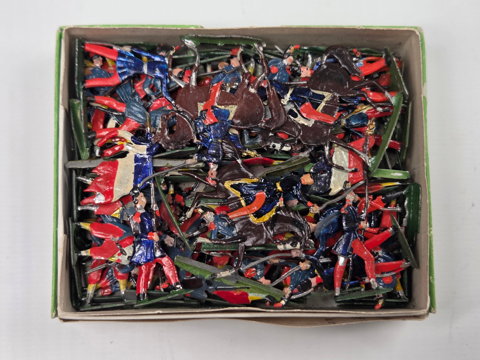 ANTIQUE ERNST HEINRICHSEN GERMAN FLAT SOLDIERS W/ BOX: ALL REMAIN IN FAIR TO GOOD CONDITION, SHOWING SOME LIGHT TYPICAL WEAR. ORIGINAL BOX REMAINS IN FAIR TO GOOD CONDITION, SHOWING STORAGE WEAR.