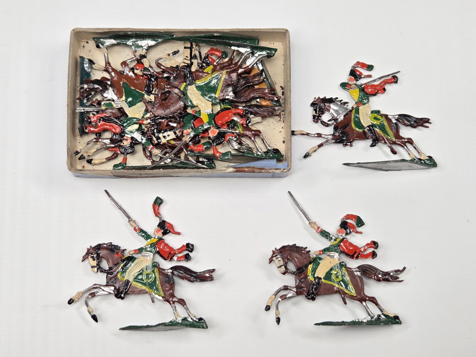 ANTIQUE ERNST HEINRICHSEN GERMAN FLAT SOLDIERS W/ BOX: ALL REMAIN IN FAIR TO GOOD CONDITION, SHOWING SOME LIGHT TYPICAL WEAR. ORIGINAL BOX REMAINS IN FAIR TO GOOD CONDITION, SHOWING STORAGE WEAR.