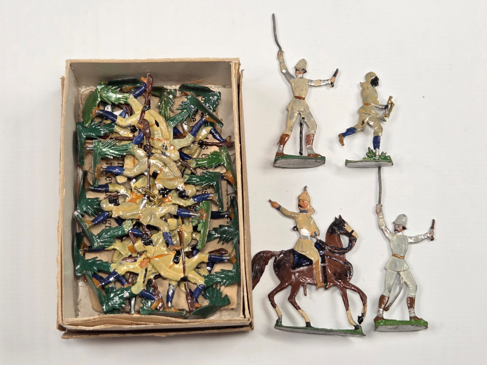 ANTIQUE ERNST HEINRICHSEN GERMAN FLAT SOLDIERS W/ BOX: ALL REMAIN IN FAIR TO GOOD CONDITION, SHOWING SOME LIGHT TYPICAL WEAR. ORIGINAL BOX REMAINS IN FAIR TO GOOD CONDITION, SHOWING STORAGE WEAR.