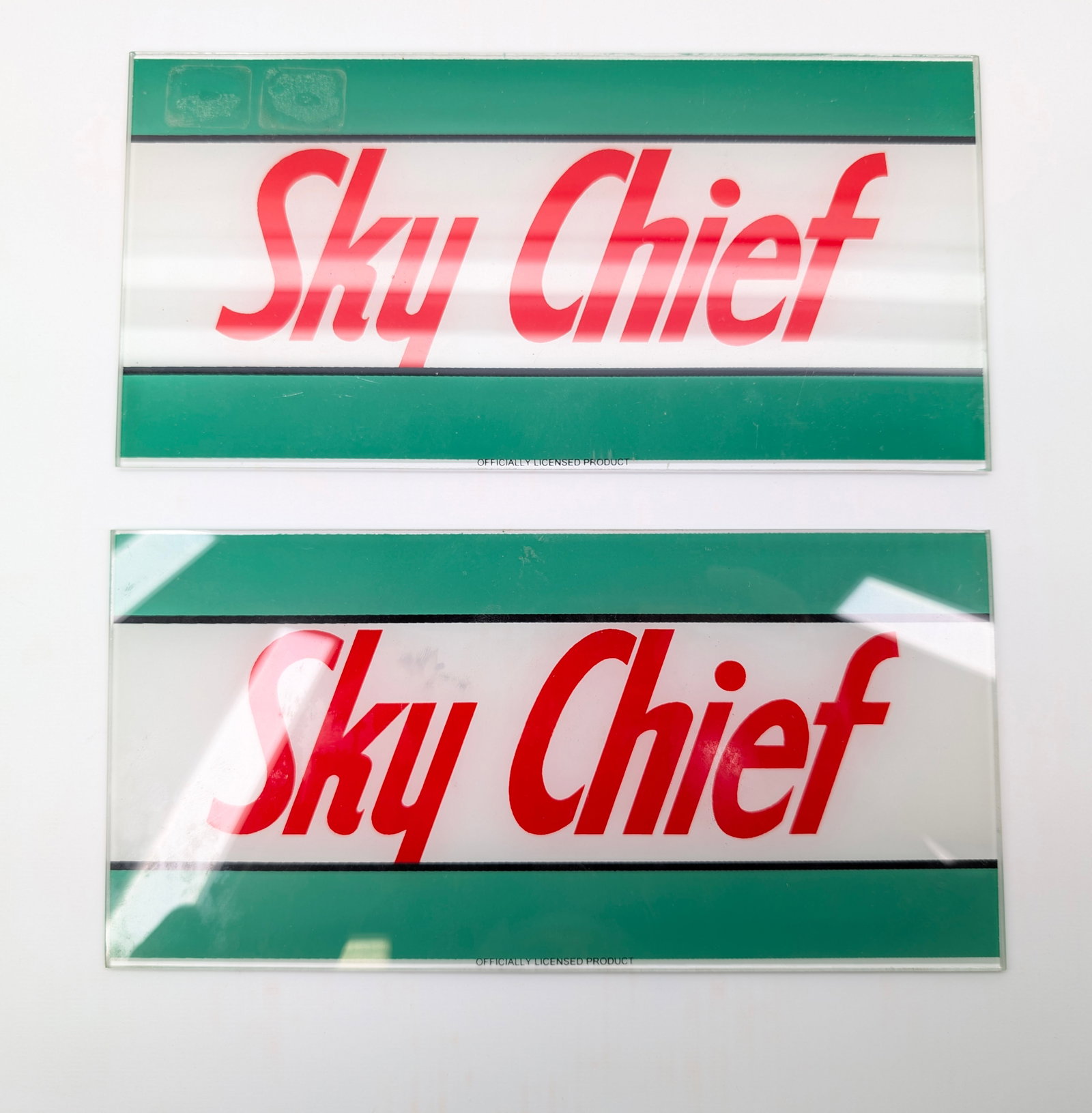 2) SKY CHIEF GLASS GAS PUMP SIGNS: BOTH REMAIN IN GOOD CONDITION, NO CHIPS OR CRACKS.