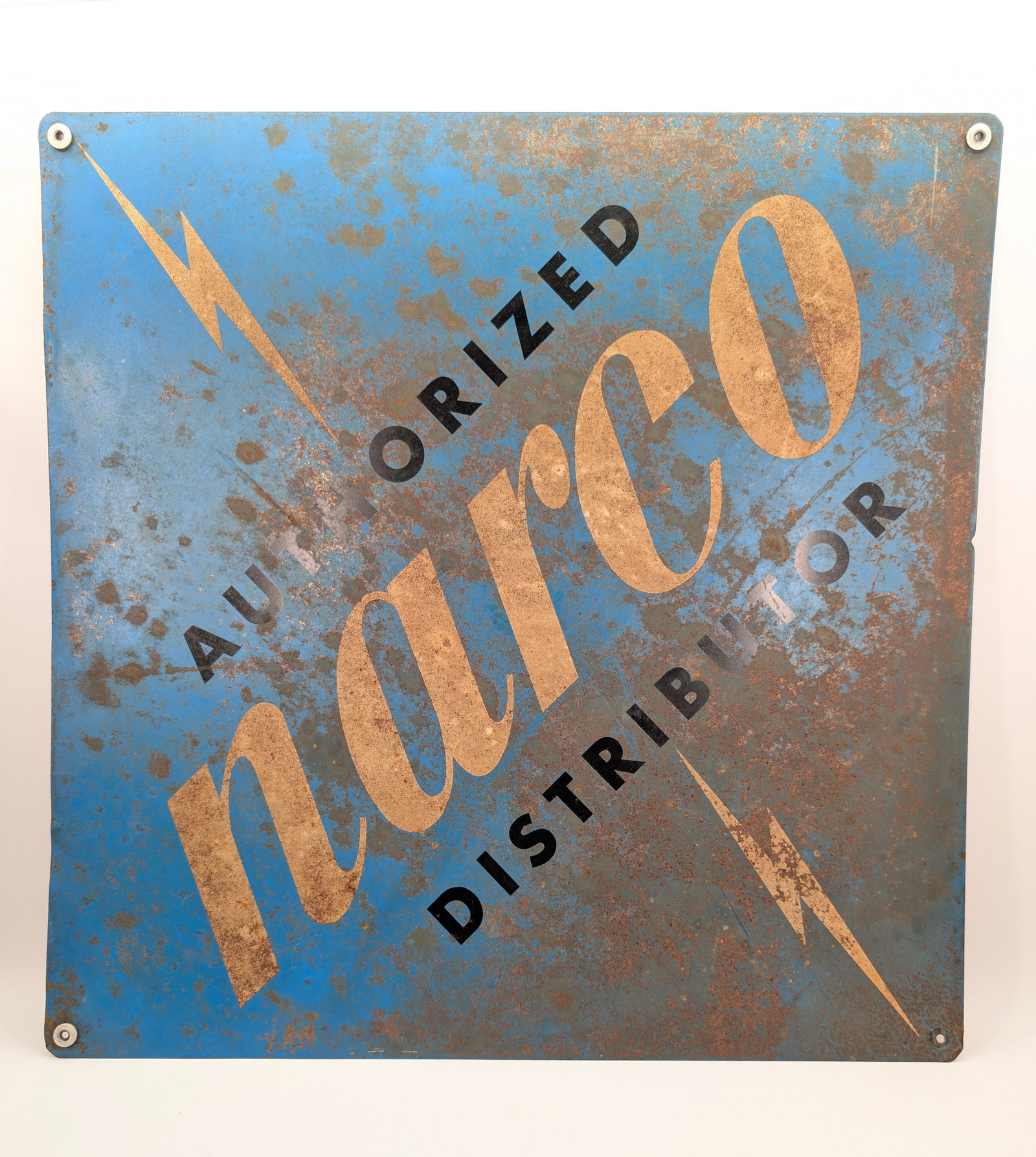 VINTAGE AUTHORIZED NARCO DISTRIBUTOR METAL SIGN: REMAINS IN FAIR CONDITION, SHOWING WEAR THROUGHOUT.