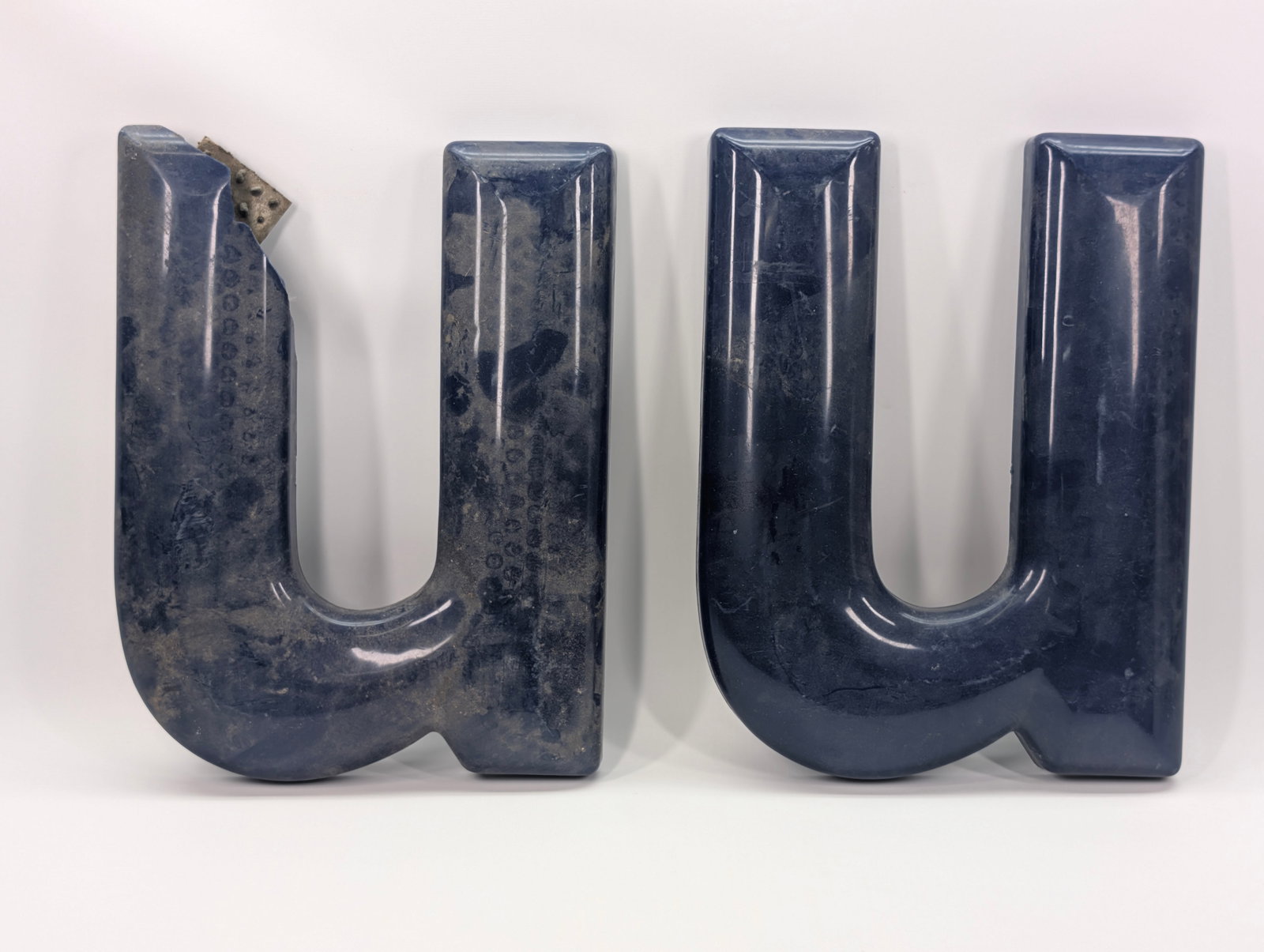 VINTAGE PLASTIC SERVICE STATION LETTERS: ALL REMAIN IN GOOD CONDITION, SHOWING SOME TYPICAL WEAR. ALL DIRTY, NEEDING CLEANED. ONE OF THE LETTER "U" HAS A CHIP IN THE CORNER.
