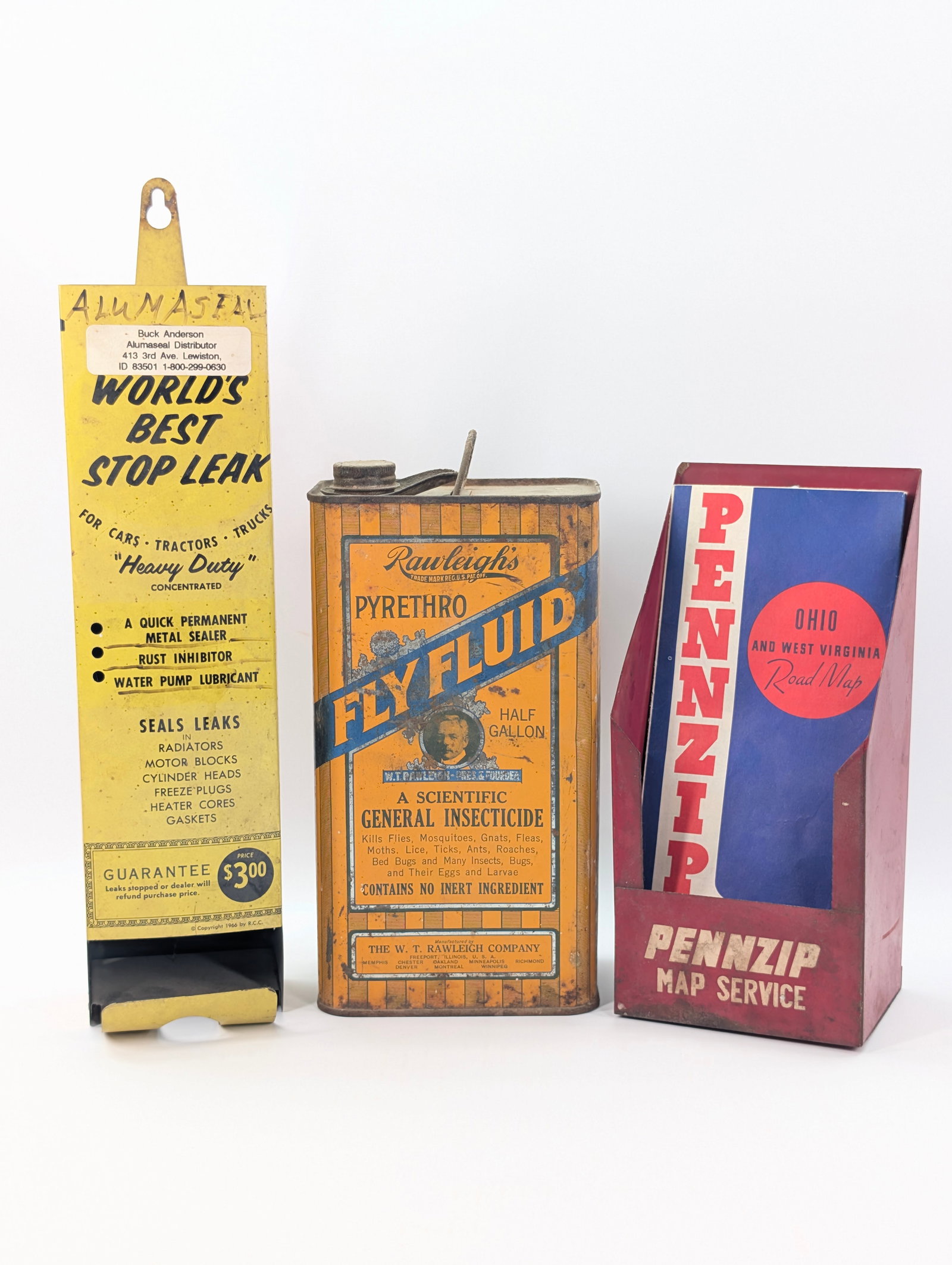 PENNZIP MAP SERVICE, RAWLEIGHS FLY FLUID CAN, STOP LEAK DISPLAY: ALL REMAIN IN FAIR TO GOOD CONDITION, SHOWING SOME TYPICAL USAGE WEAR.