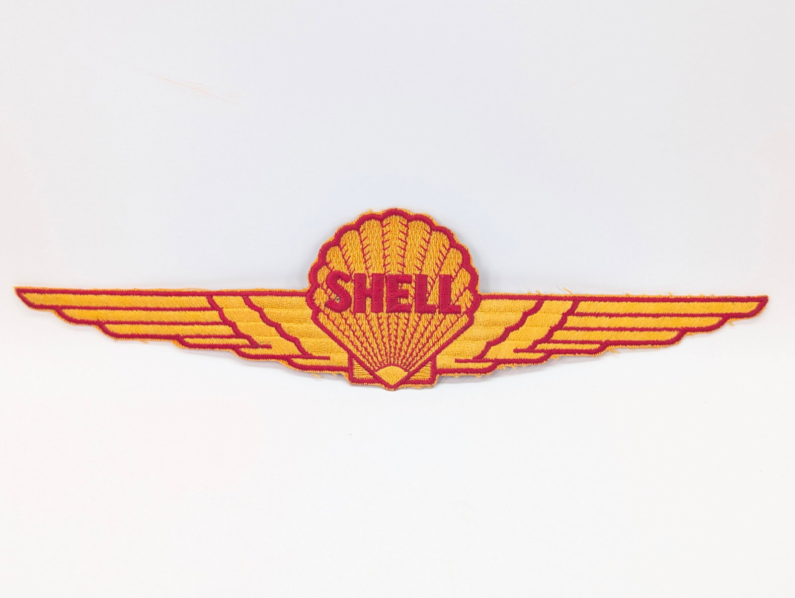 14" SHELL WINGS OIL PATCH: REMAINS IN GOOD CONDITION.
