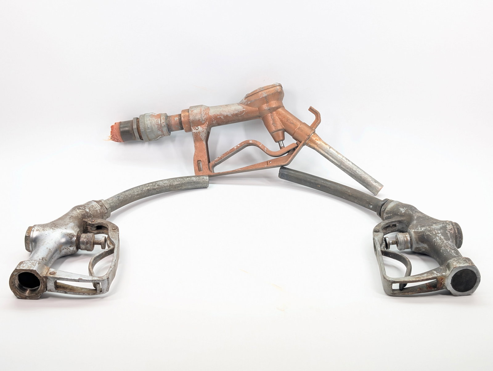 3) ANTIQUE GAS PUMP NOZZLES: ALL REMAIN IN FAIR TO GOOD CONDITION, SHOWING SOME TYPICAL USAGE WEAR.