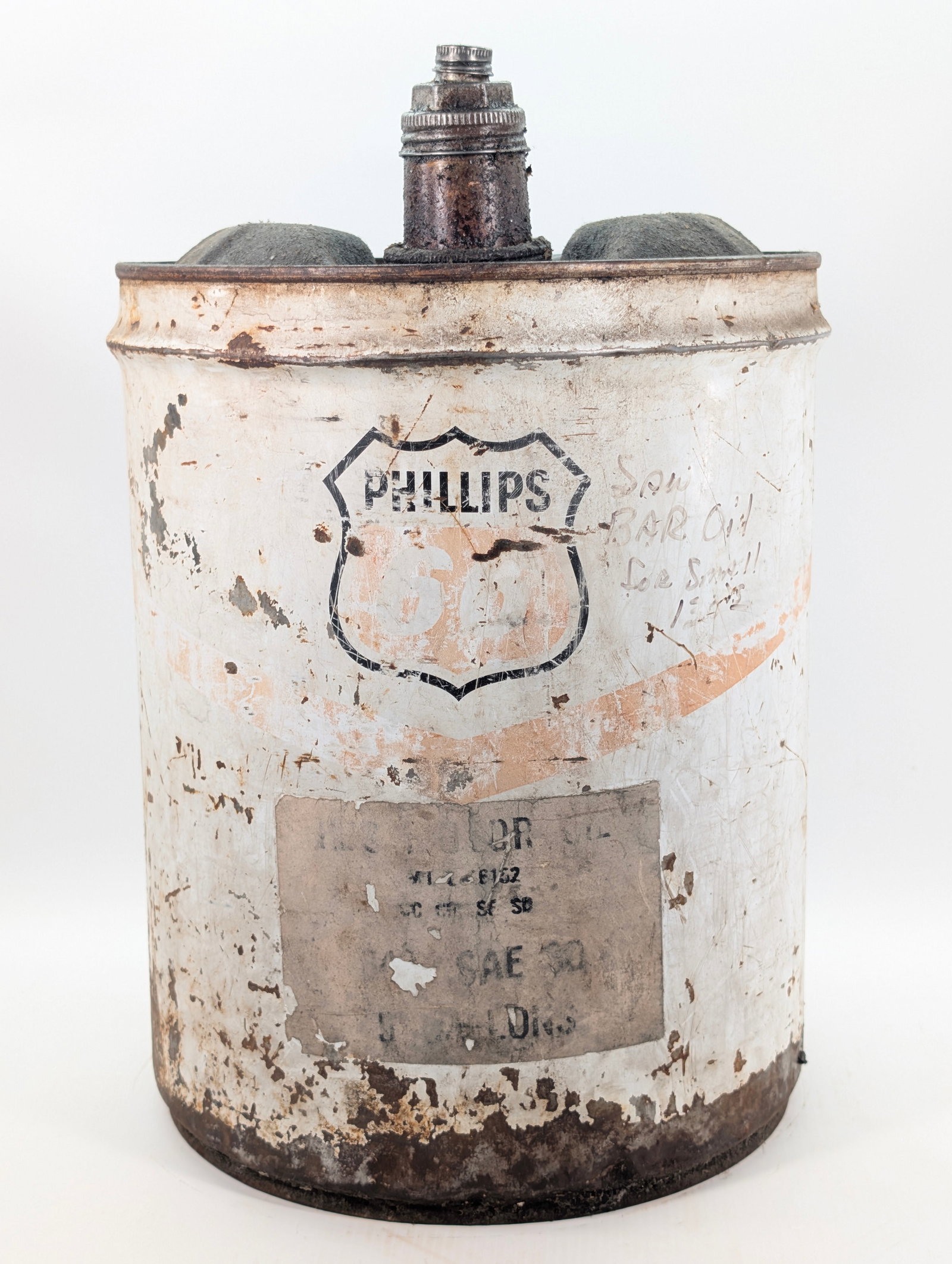 PHILLIPS 66 5 GALLON MOTOR OIL CAN: REMAINS IN POOR CONDITION, SHOWING WEAR THROUGHOUT WITH COLOR FADING.