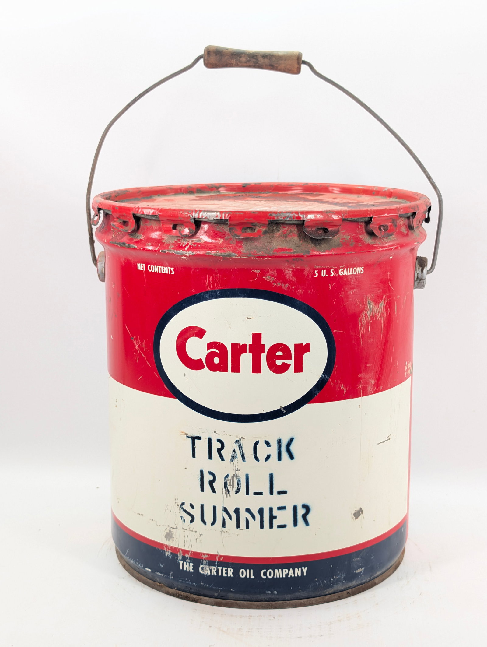 CARTER ESSO TRACK ROLLER SUMMER 5 GALLON BUCKET: REMAINS IN FAIR TO GOOD CONDITION, SHOWING SOME TYPICAL WEAR.