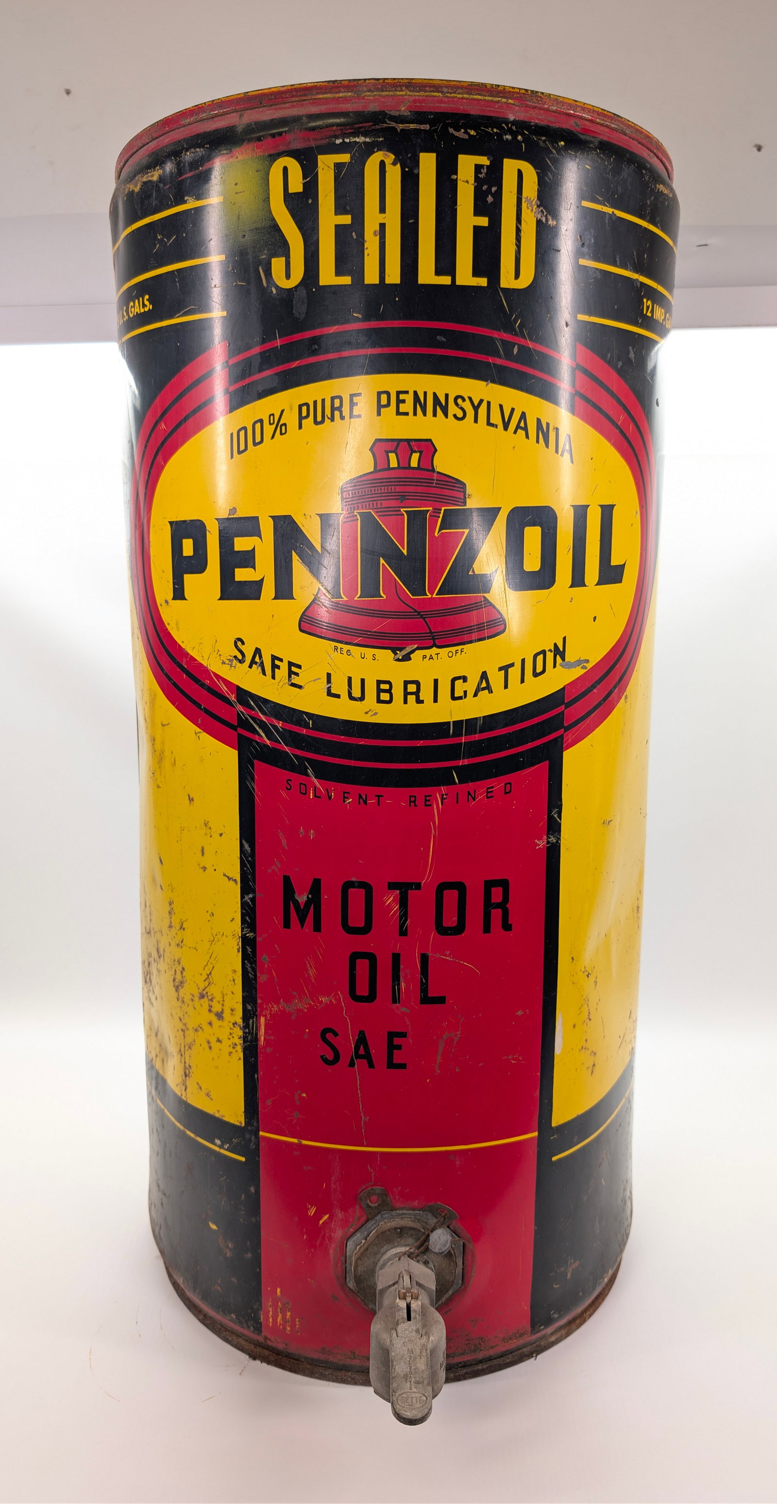 PENNZOIL 36" SAE MOTOR OIL BARREL DISPENSER: REMAINS IN FAIR TO GOOD CONDITION, SHOWING WEAR THROUGHOUT. DENTS AND PAINT LOSS.