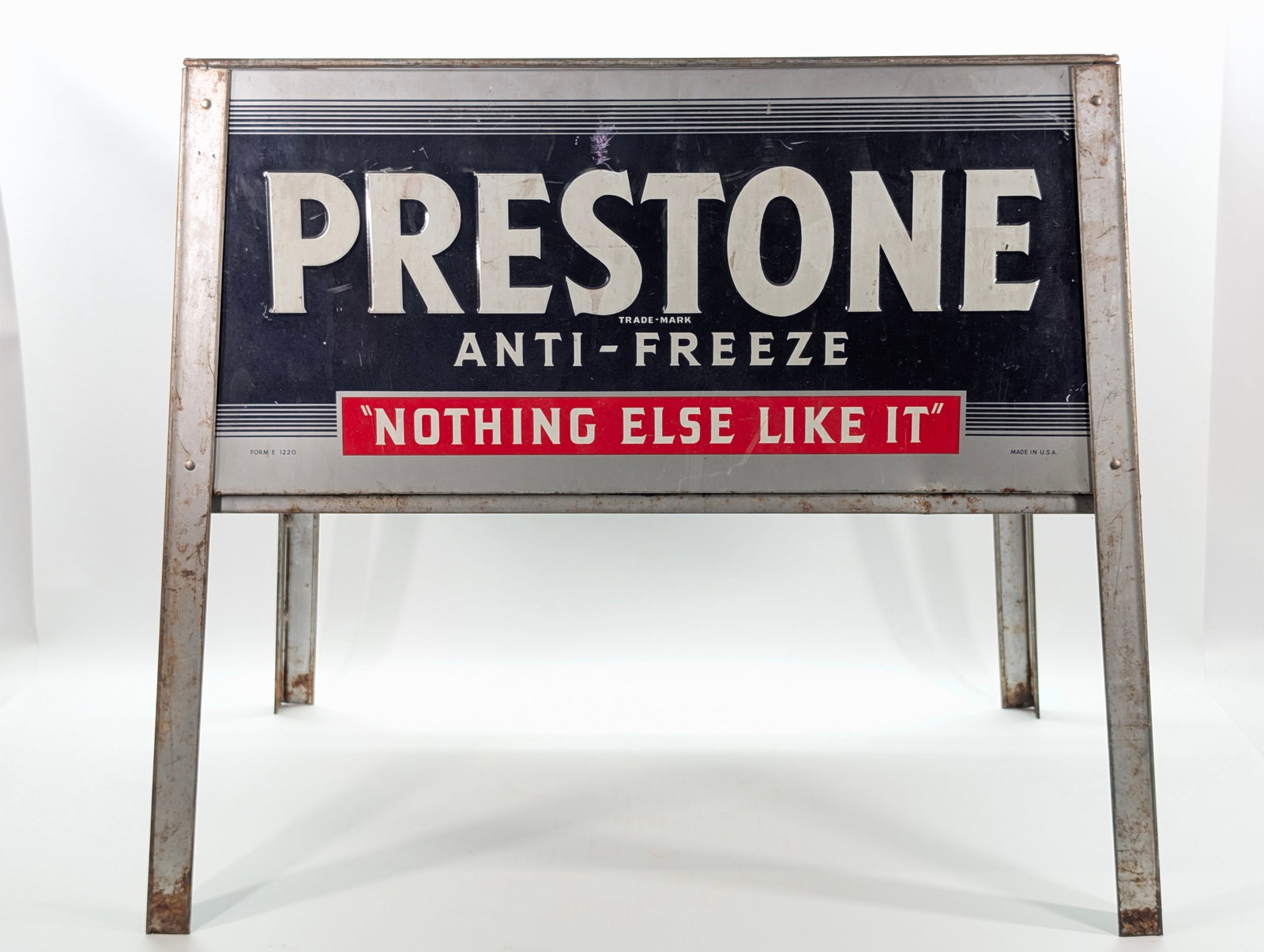 PRESTONE ANTIFREEZE METAL CABINET DISPLAY STAND: REMAINS IN FAIR TO GOOD CONDITION, SHOWING TYPICAL WEAR THROUGHOUT.