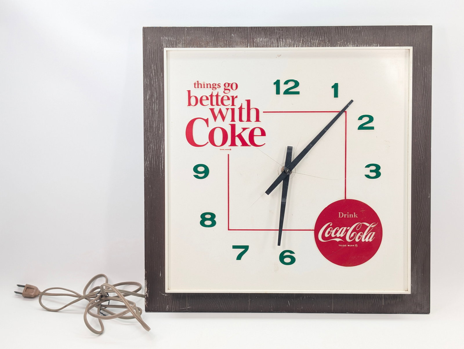VINTAGE PLASTIC COCA COLA SQUARE CLOCK: REMAINS IN FAIR CONDITION, SHOWING TYPICAL USAGE WEAR. MULTIPLE CRACKS WHERE AT CENTER WHERE HANDS ARE LOCATED. UNTESTED.