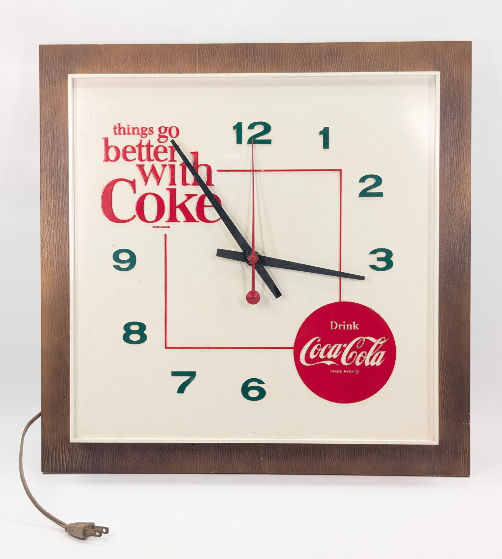 VINTAGE PLASTIC COCA COLA SQUARE CLOCK: REMAINS IN FAIR CONDITION, SHOWING TYPICAL USAGE WEAR. MULTIPLE CRACKS WHERE AT CENTER WHERE HANDS ARE LOCATED. UNTESTED.
