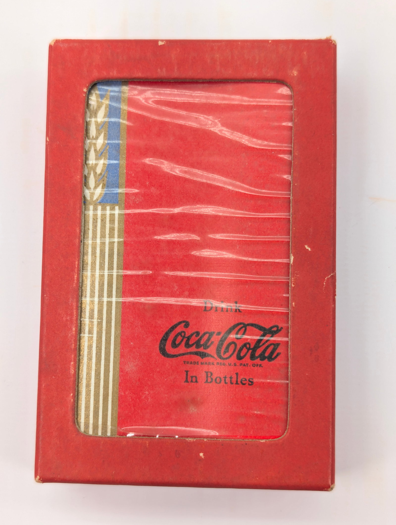 VINTAGE COCA COLA UNOPENED PLAYING CARDS: REMAINS IN VERY GOOD CLEAN UNOPENED CONDITION. SHOWING LIGHT WEAR.
