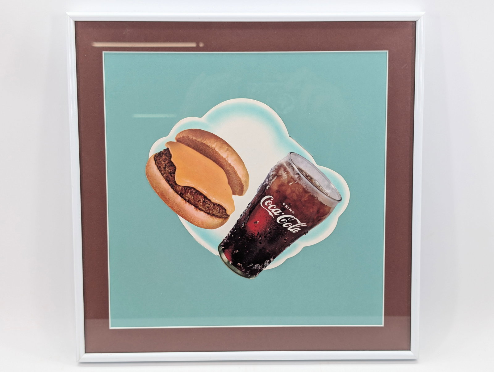 VINTAGE COCA COLA & CHEESEBURGER SMALL SIGN FRAMED: REMAINS IN VERY GOOD CONDITION, NICELY MATTED AND FRAMED.