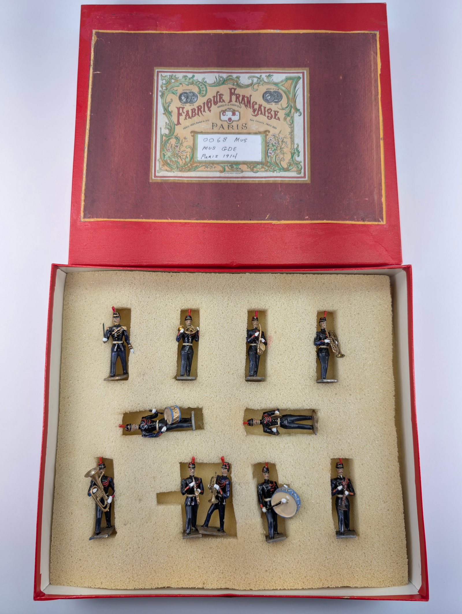 C.B.G. MIGNOT BAND OF THE GUARD: SET REMAINS IN GOOD CONDITION, SHOWING SOME LIGHT TYPICAL WEAR.