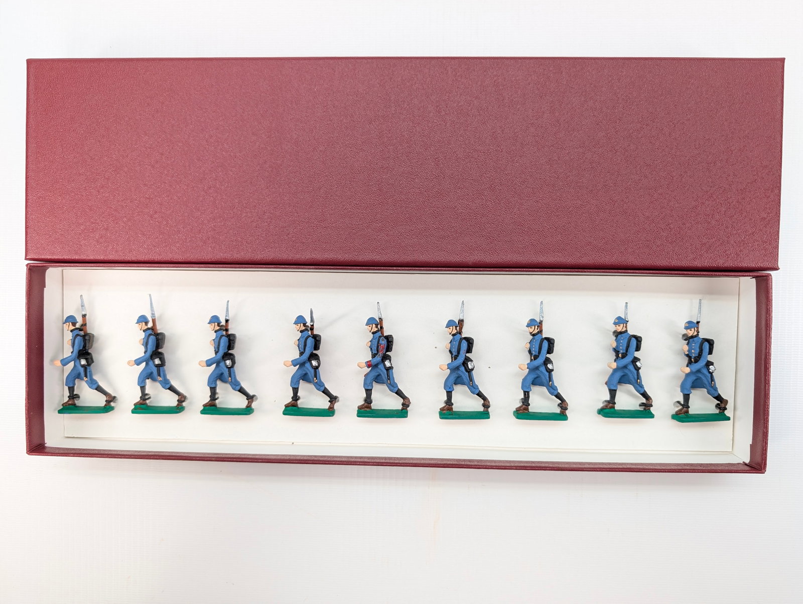 FRENCH HAND PAINTED SOLDIER SET: SET REMAINS IN GOOD CONDITION, SHOWING SOME TYPICAL WEAR. CUSTOM BOX.