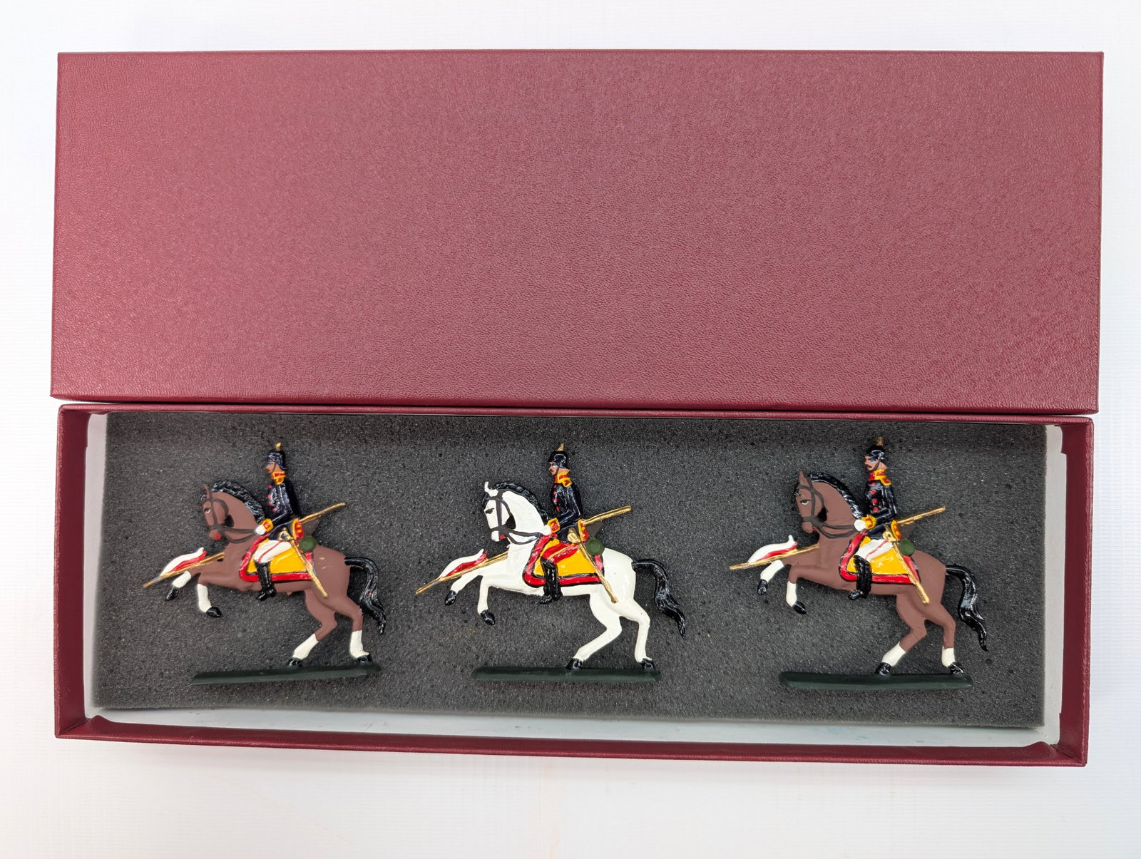 AMBASSADOR PRUSSIAN LANCERS HAND PAINTED SET: SET REMAINS IN GOOD CONDITION, SHOWING SOME TYPICAL WEAR. CUSTOM BOX.