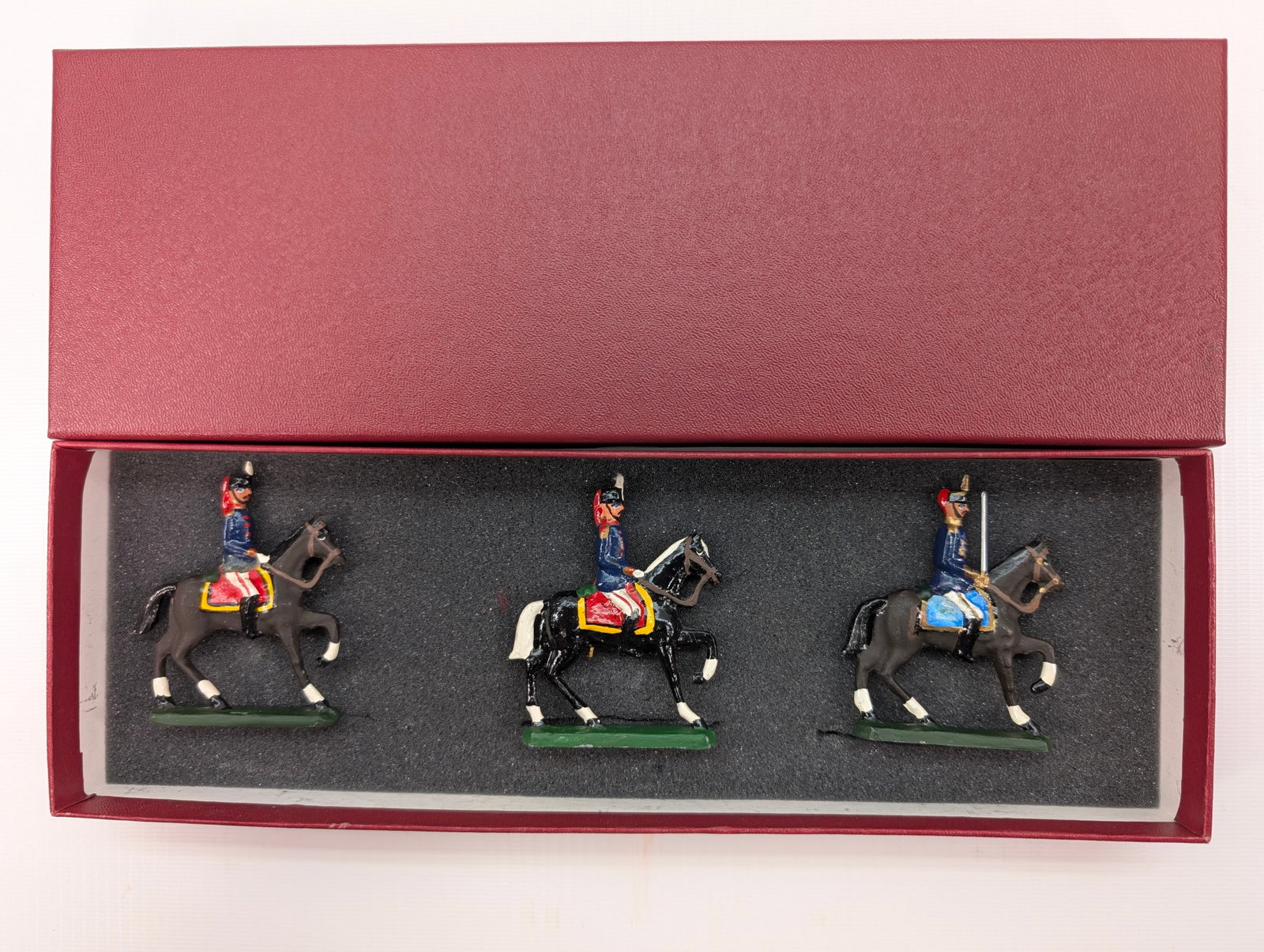AMBASSADOR HAND PAINTED CAVALRY SOLDIERS SET: SET REMAINS IN GOOD CONDITION, SHOWING SOME TYPICAL WEAR. CUSTOM BOX.