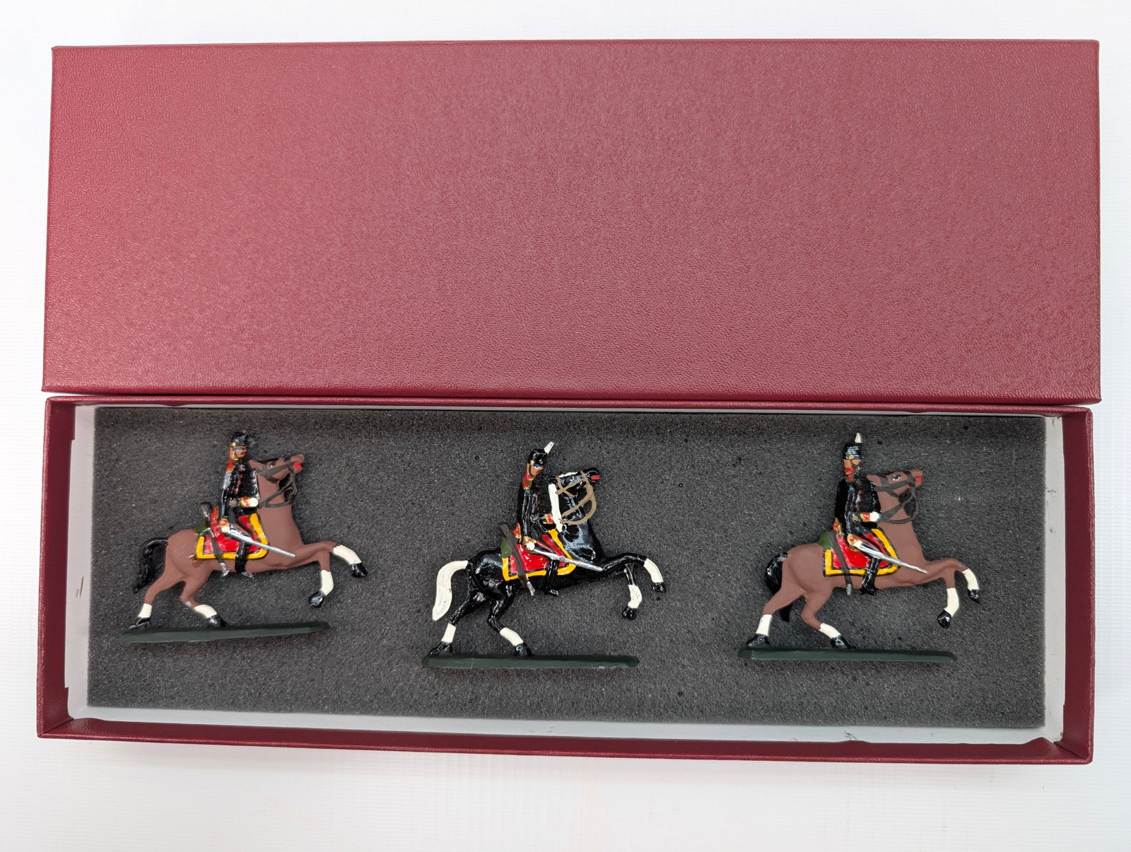 AMBASSADOR HAND PAINTED CAVALRY SOLDIERS SET: SET REMAINS IN GOOD CONDITION, SHOWING SOME TYPICAL WEAR. CUSTOM BOX.