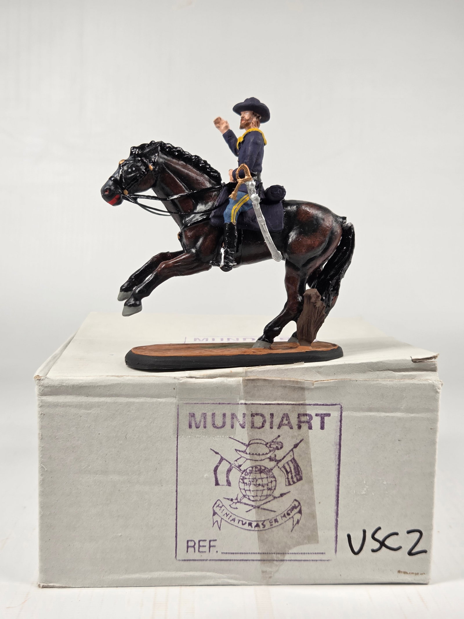 MUNDIART HAND PAINTED MOUNTED LEAD SOLDIER: REMAINS IN GOOD CONDITION, HOWEVER TAIL IS BROKEN.