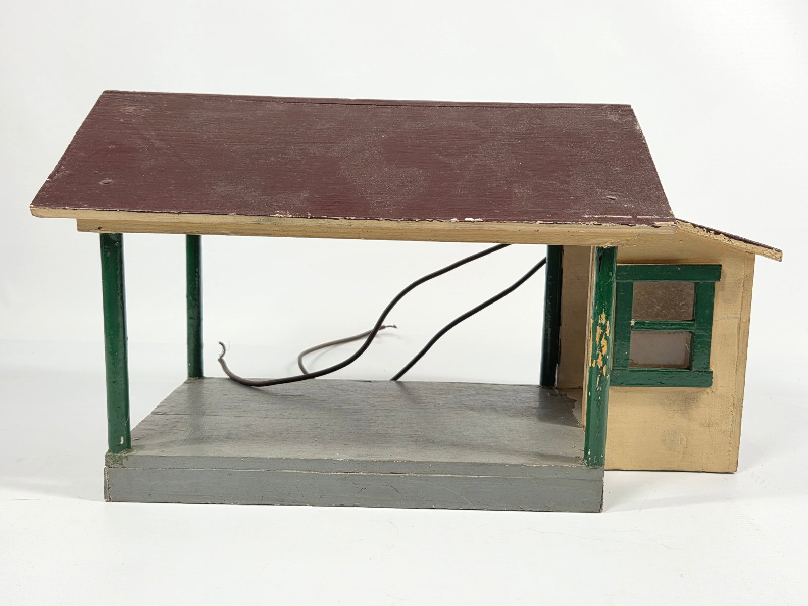 ANTIQUE PRIMITIVE WOOD HAND PAINTED TRAIN BUILDING: REMAINS IN FAIR TO GOOD CONDITION, SHOWING TYPICAL USAGE WEAR THROUGHOUT.