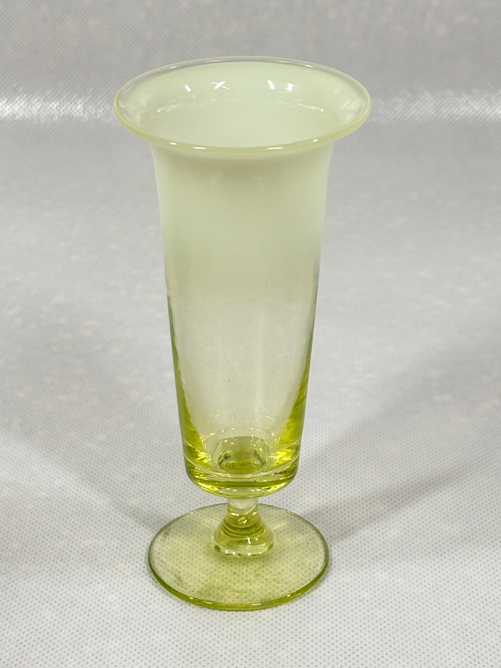 ANTIQUE VASELINE CANARY GLASS TRUMPET VASE: REMAINS IN VERY GOOD, SMALL AIR BUBBLE ALONG EDGE.