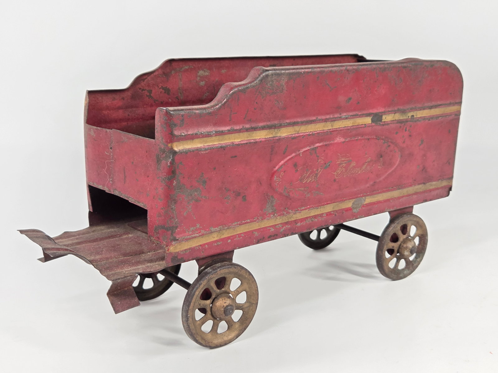 ANTIQUE PRESSED STEEL LIL CLIMBER TRAIN TENDER: REMAINS IN FAIR CONDITION, SHOWING PAINT WEAR AND SCRATCHES.