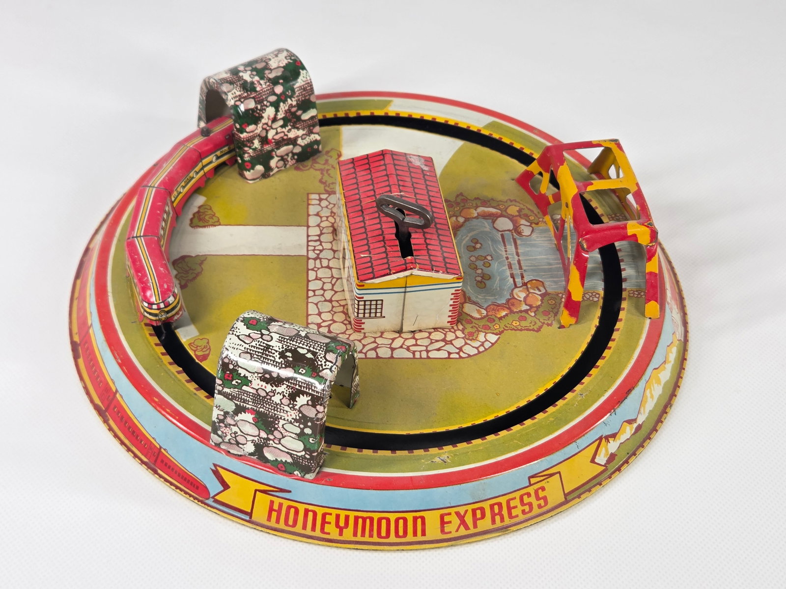 MARX TIN LITHO WIND UP HONEYMOON EXPRESS: REMAINS IN GOOD CLEAN CONDITION. WIND UP MECHANISM WORKS.