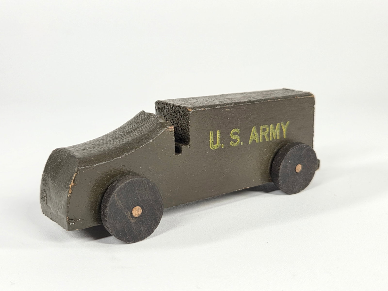 SMALL 4" WOOD US ARMY TRUCK: REMAINS IN GOOD CONDITION, SHOWING SOME TYPICAL WEAR.