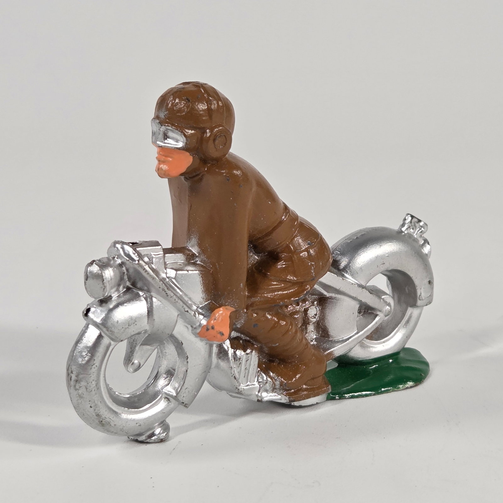 MANOIL LEAD SOLDIER RIDING MOTORCYCLE: REMAINS IN EXCELLENT CONDITION.
