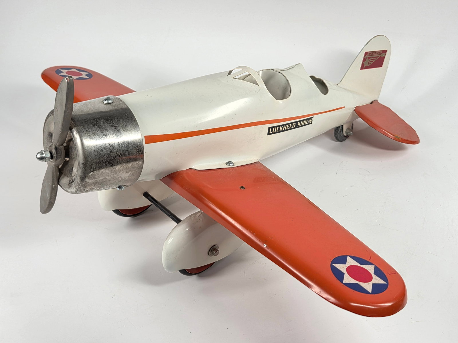 RESTORED STEELCRAFT PRESSED STEEL LOCKHEED AIRPLANE: REMAINS IN VERY GOOD RESTORED CONDITION, SHOWING SOME LIGHT TYPICAL WEAR.