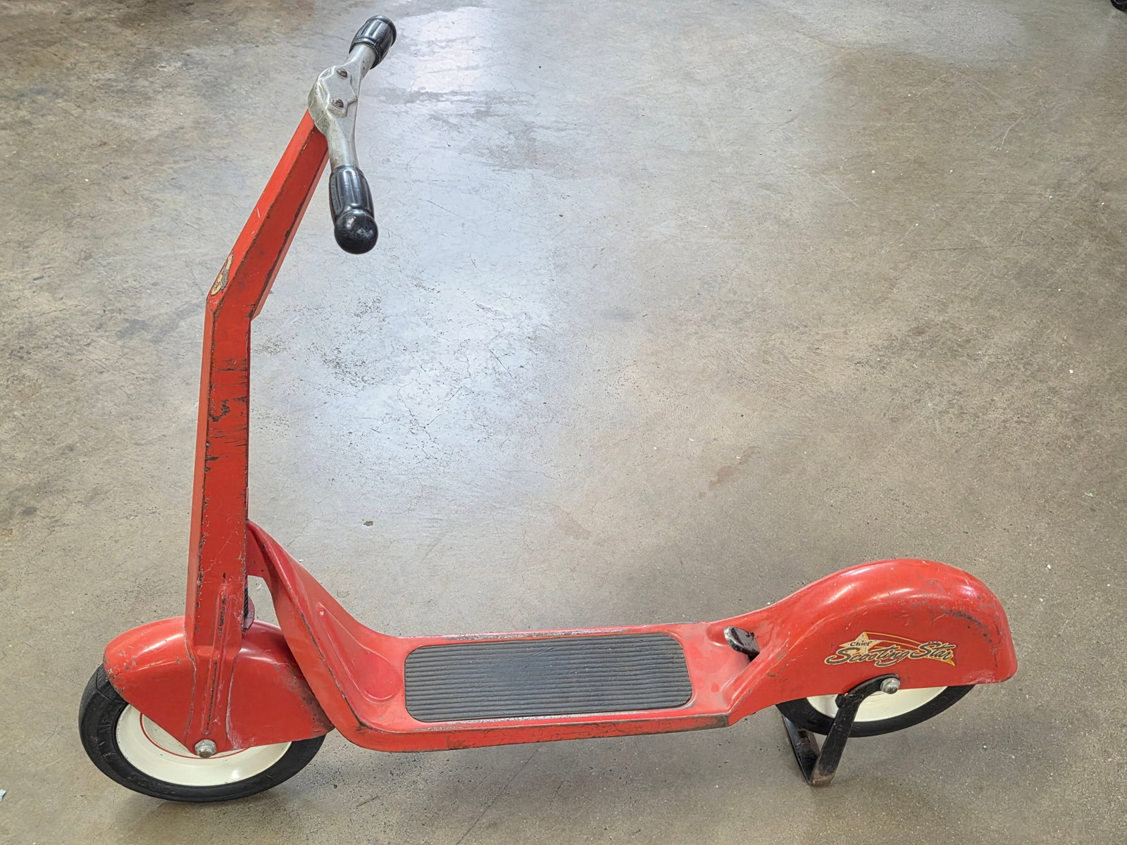 CHIEF SCOOTING STAR PRESSED STEEL SCOOTER: REMAINS IN FAIR TO GOOD ORIGINAL CONDITION, SHOWING SOME TYPICAL USAGE WEAR. **PLEASE NOTE** THIS ITEM IS NOT AVAILABLE FOR SHIPPING. PICK UP ONLY PLEASE.