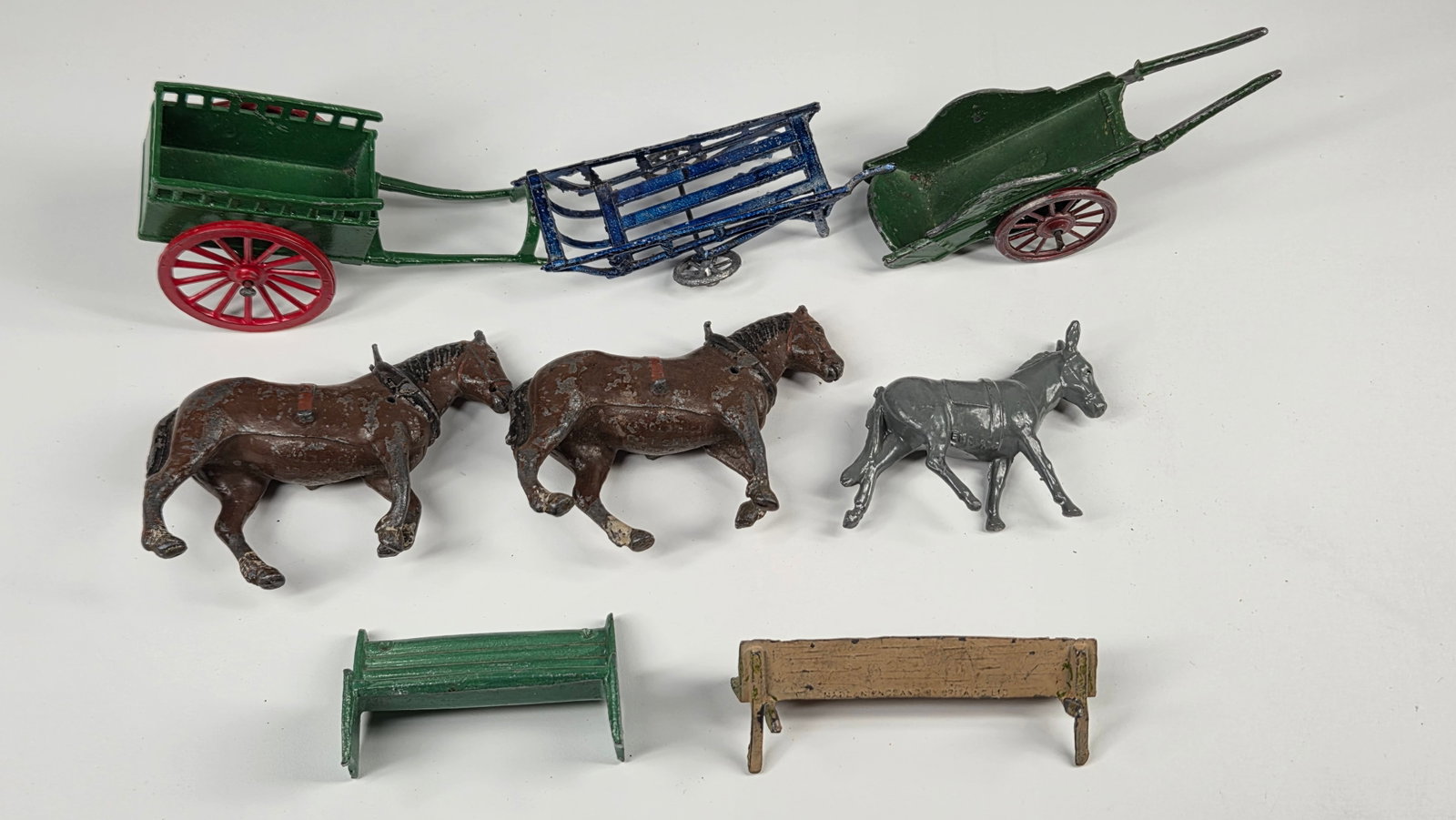 ASSORTED PAINTED METAL HORSES WITH CARTS, BENCHES: ALL REMAIN IN GOOD CONDITION, SHOWING SOME TYPICAL WEAR