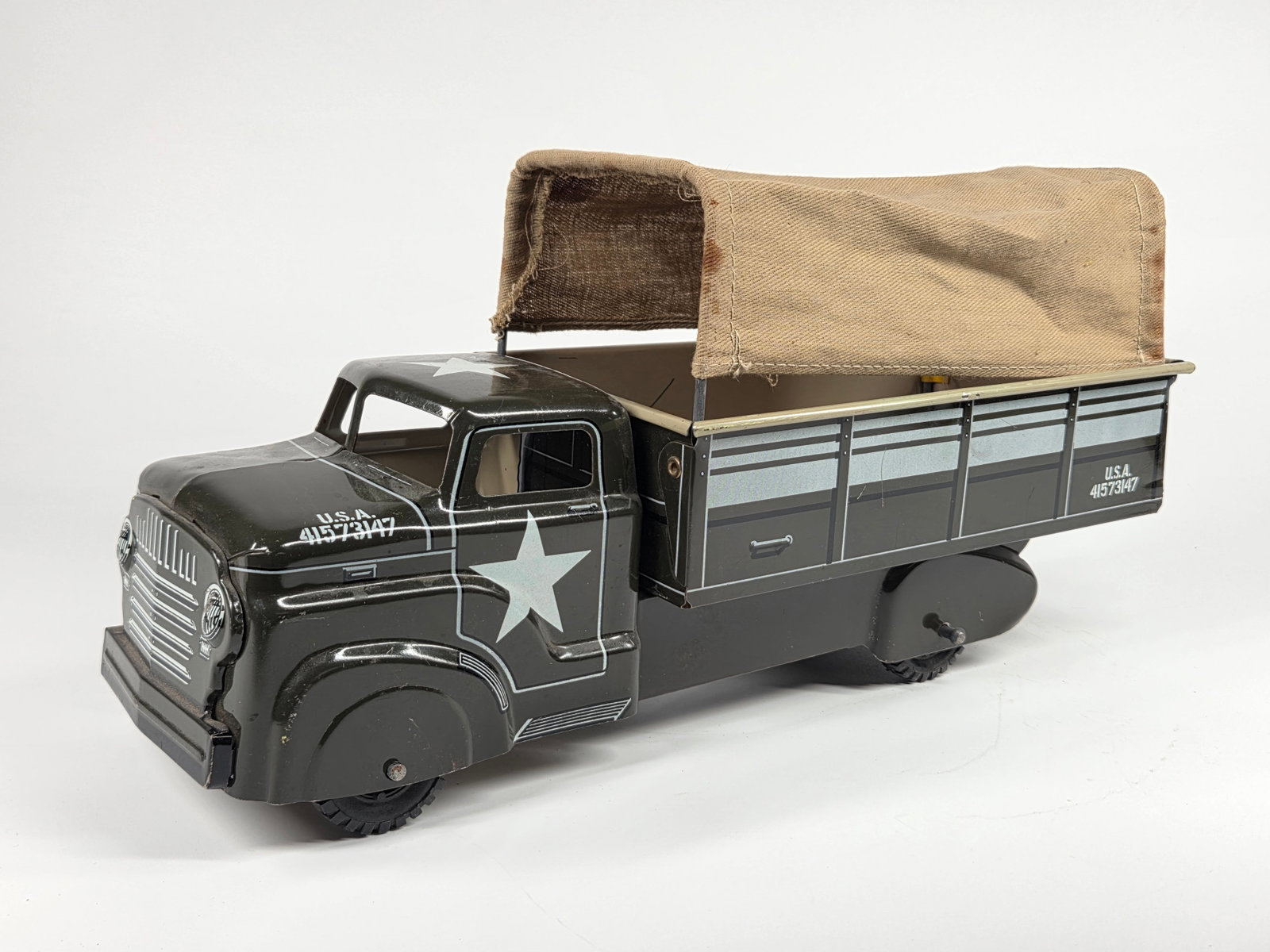 MARX PRESSED STEEL US ARMY TROOP CARRIER TRUCK: REMAINS IN GOOD CONDITION, SHOWING LIGHT WEAR. ORIGINAL CANVAS TOP.