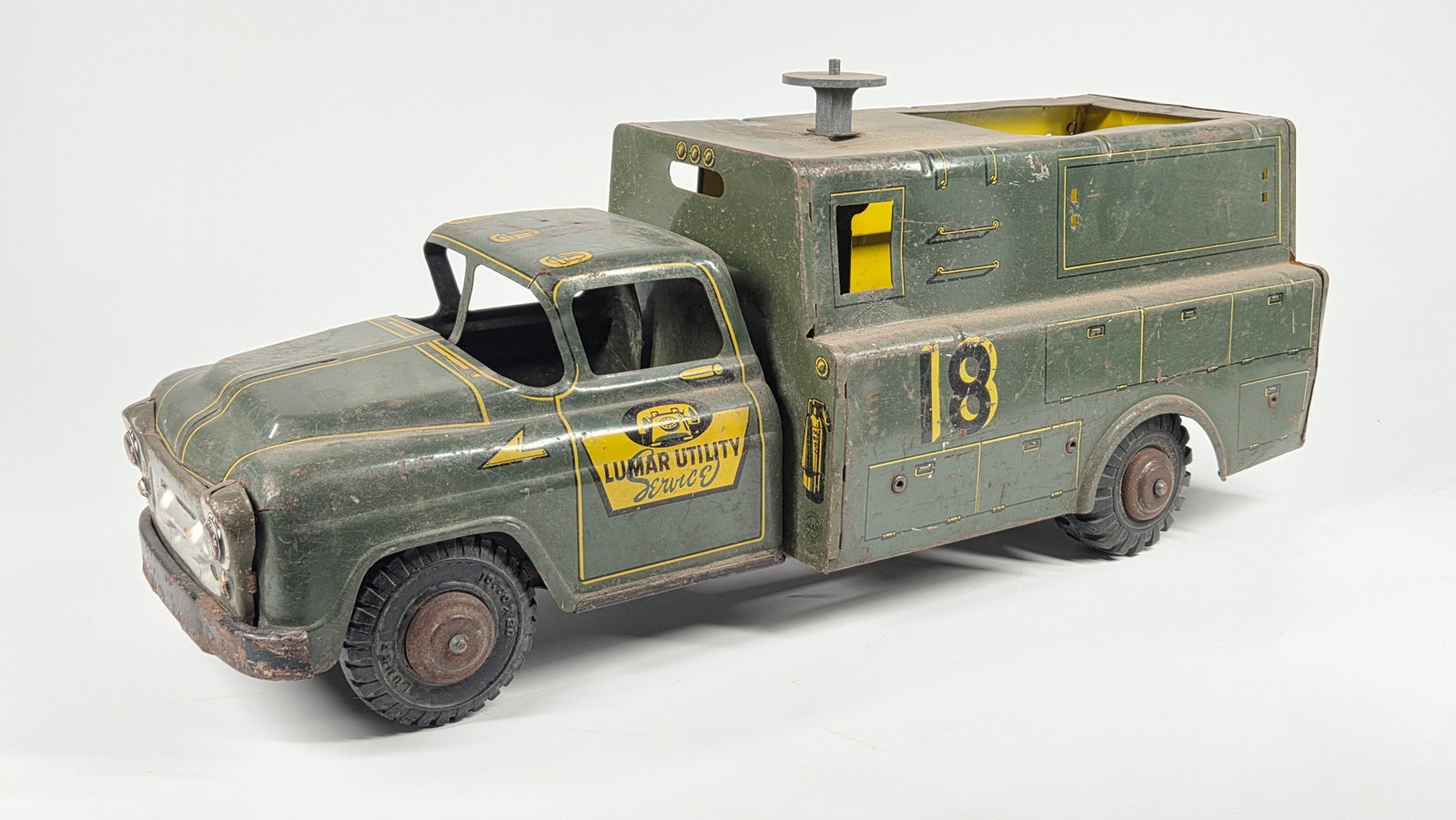 LUMAR MARX PRESSED STEEL UTILITY SERVICE TRUCK: REMAINS IN FAIR CONDITION, SHOWING TYPICAL WEAR THROUGHOUT AND MISSING PIECES.