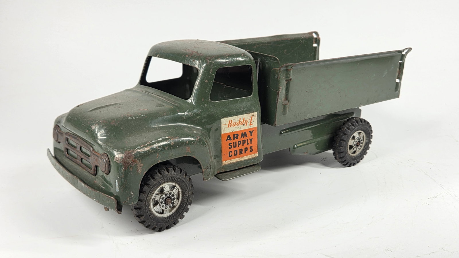 BUDDY L PRESSED STEEL ARMY SUPPLY CORPS TRUCK: REMAINS IN FAIR TO GOOD CONDITION, SHOWING SOME TYPICAL USAGE WEAR.
