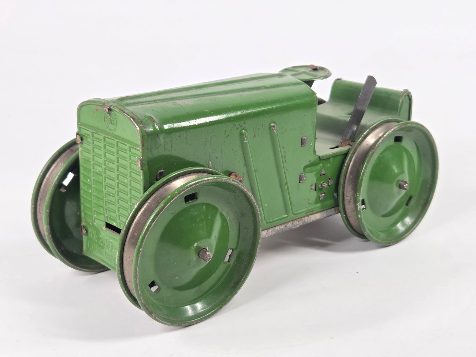 GREEN MARX TIN LITHO WIND UP TRACTOR: REMAINS IN GOOD CONDITION, SHOWING SOME TYPICAL USAGE WEAR. WIND UP MECHANISM WORKS.