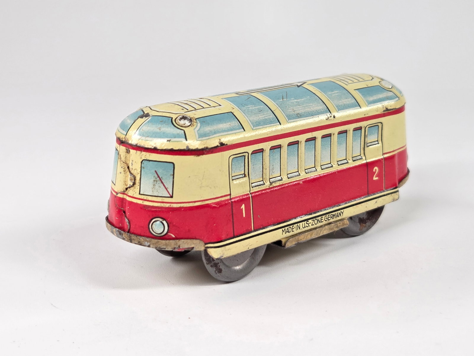 U.S. ZONE GERMANY TIN WIND UP BUS TROLLEY: REMAINS IN FAIR TO GOOD CONDITION, SHOWING SOME TYPICAL WEAR. UNTESTED.