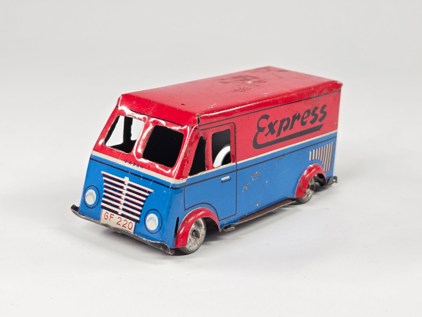 JAPAN TIN LITHO EXPRESS DELIVERY VAN: REMAINS IN FAIR TO GOOD CONDITION, SHOWING SOME TYPICAL WEAR.