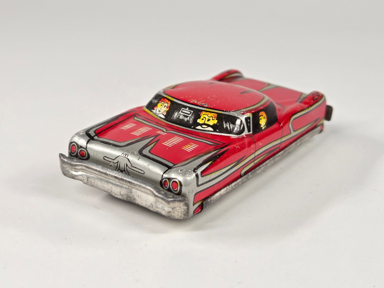 SMALL JAPAN TIN FRICTION FUTURISTIC CADILLAC - RED: REMAINS IN GOOD CONDITION, SHOWING SOME TYPICAL WEAR. FRICTION MOTOR WORKS.