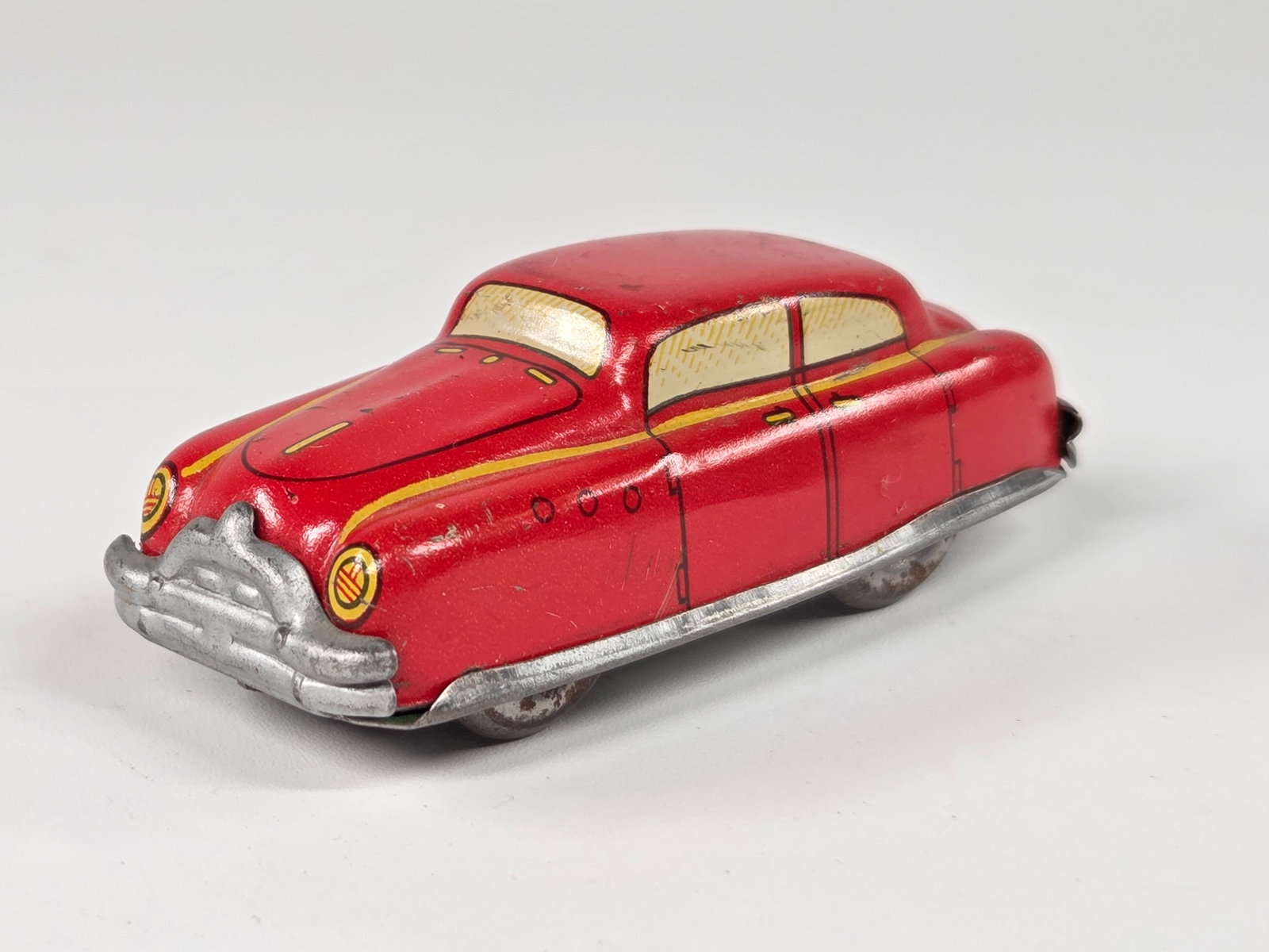 AUTOMATIC TOY USA TIN LITHO WIND UP CAR - RED: REMAINS IN GOOD CONDITION, SHOWING SOME TYPICAL WEAR.