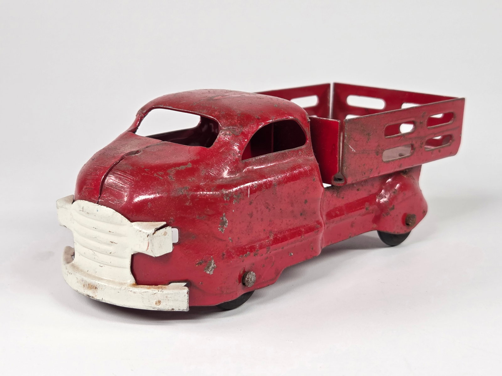 WYANDOTTE PRESSED STEEL STAKE BODY TRUCK: REMAINS IN FAIR TO GOOD CONDITION, SHOWING TYPICAL USAGE WEAR.