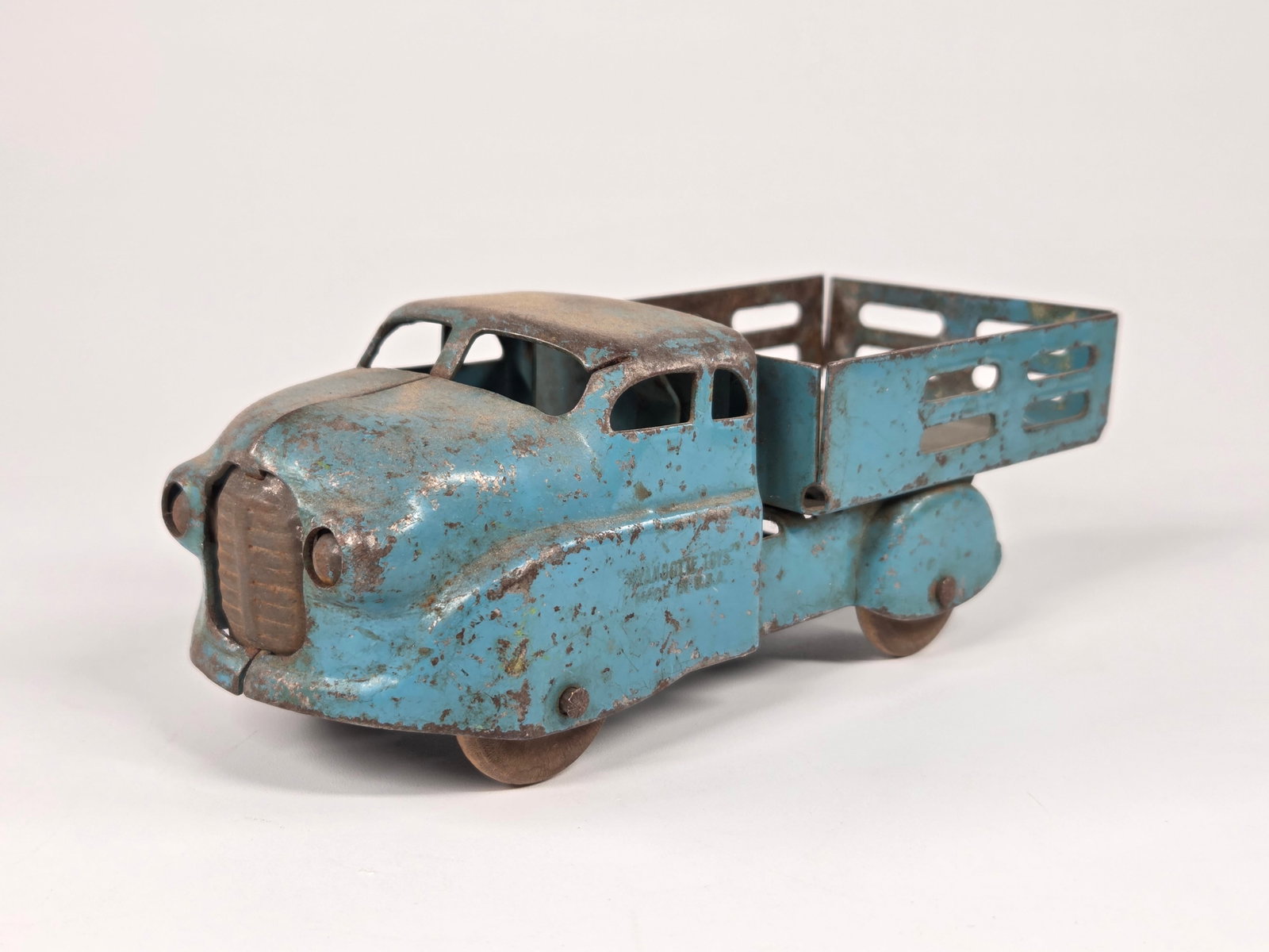 BLUE WYANDOTTE TOYS PRESSED STEEL STAKE BODY TRUCK: REMAINS IN FAIR CONDITION, SHOWING TYPICAL USAGE WEAR THROUGHOUT.
