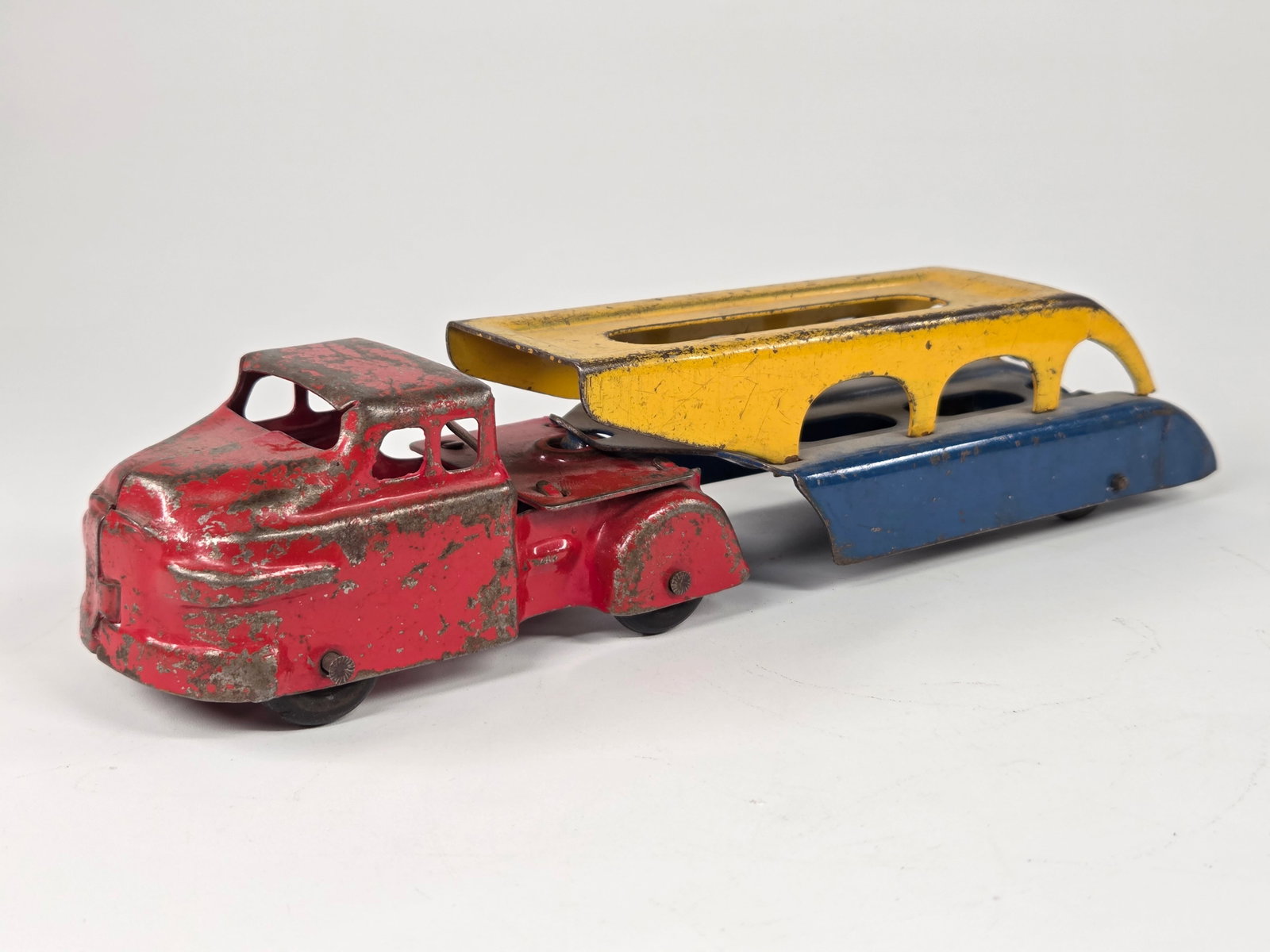 WYANDOTTE PRESSED STEEL CAR CARRIER TRUCK: REMAINS IN FAIR TO GOOD CONDITION, SHOWING TYPICAL USAGE WEAR.