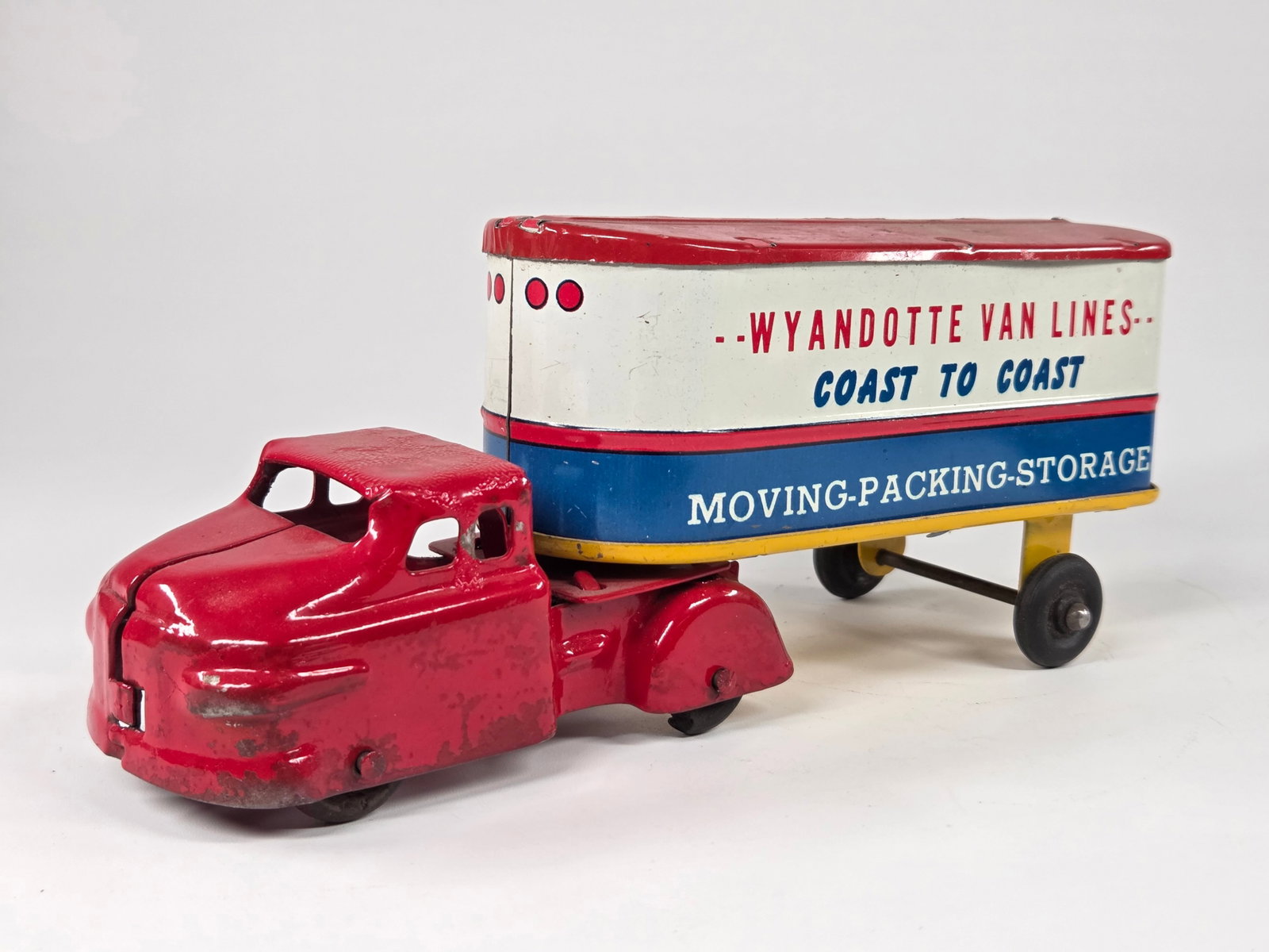 WYANDOTTE PRESSED STEEL COAST TO COAST TRUCK: REMAINS IN FAIR TO GOOD CONDITION, SHOWING SOME TYPICAL WEAR. CAB SHOWS RED PAINTED SPOTS.