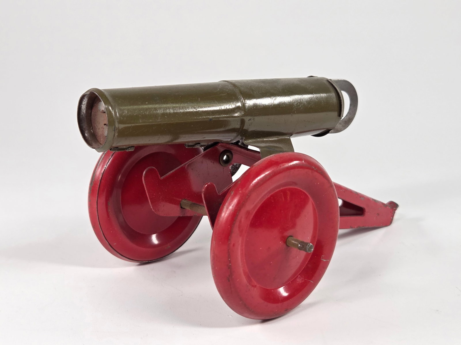 VINTAGE PRESSED STEEL TOY CANNON: REMAINS IN GOOD CONDITION, SHOWING SOME LIGHT TYPICAL WEAR.
