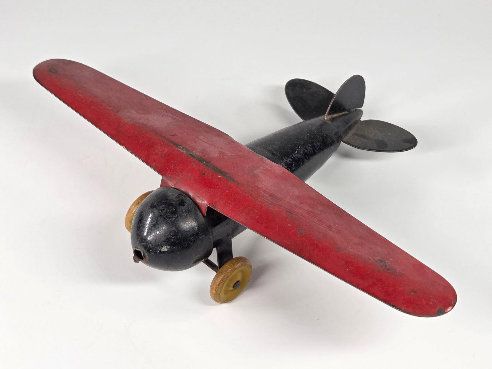 WYANDOTTE PRESSED STEEL AIRPLANE: REMAINS IN GOOD CONDITION, SHOWING SOME TYPICAL USAGE WEAR.